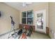 Relaxing enclosed patio with a ceiling fan, exercise machine and a bike at 927 Contessa Dr, Cary, NC 27513