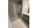 Stylish bathroom with a glass-enclosed shower and modern vanity at 0416 Hazy Hls Ln, Garner, NC 27529