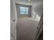 Bright bedroom featuring a window and neutral carpeting at 0416 Hazy Hls Ln, Garner, NC 27529