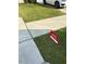 Home for sale sign on a green lawn beside a driveway and vehicle at 0416 Hazy Hls Ln, Garner, NC 27529