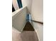 Carpeted stairs with wood railing leading to the upper level of the home at 0416 Hazy Hls Ln, Garner, NC 27529