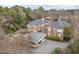 Aerial view of the complex with parking lot and surrounding trees at 100 Edenburgh Rd # 202, Raleigh, NC 27608