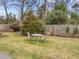 Green back yard featuring table and chairs at 100 Edenburgh Rd # 202, Raleigh, NC 27608
