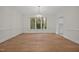 Sunlit dining room featuring hardwood floors and a chandelier at 100 Edenburgh Rd # 202, Raleigh, NC 27608