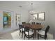 Dining room featuring a wood table, chandelier, and french doors at 100 Edenburgh Rd # 202, Raleigh, NC 27608
