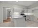 This is a kitchen featuring white cabinets and countertops at 100 Edenburgh Rd # 202, Raleigh, NC 27608