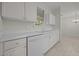 View of the kitchen sink and white cabinets at 100 Edenburgh Rd # 202, Raleigh, NC 27608