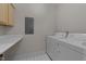 A well-equipped laundry room with tile floor, washer, and dryer at 100 Edenburgh Rd # 202, Raleigh, NC 27608