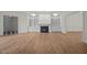 Spacious living room showcasing hardwood floors, a fireplace, and built-in shelves, perfect for entertaining or relaxing at 100 Edenburgh Rd # 202, Raleigh, NC 27608