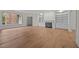 Spacious living room with a fireplace and built-in shelving, brightened by a window at 100 Edenburgh Rd # 202, Raleigh, NC 27608