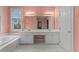 Large primary bathroom with dual vanity and separate tub at 100 Edenburgh Rd # 202, Raleigh, NC 27608