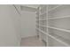 This pantry features tiled floor and white shelves at 100 Edenburgh Rd # 202, Raleigh, NC 27608