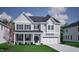 Charming two-story home featuring a covered front porch and a two-car garage in a well-kept neighborhood at 105 Guardian St, Youngsville, NC 27596