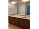 Bathroom featuring double vanity with granite countertops and modern fixtures at 108 Bally Shannon Way, Apex, NC 27539