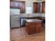 Well-equipped kitchen with stainless steel appliances and a functional center island at 108 Bally Shannon Way, Apex, NC 27539