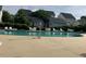 Community pool with plenty of seating and well-maintained surroundings at 108 Bally Shannon Way, Apex, NC 27539