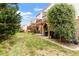 Townhome backyard showing patios and decks, landscaping and green grass at 110 Great Ridge Ct, Morrisville, NC 27560