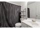 Cozy bathroom featuring a shower with black curtain, a toilet and a sink and mirror at 110 Great Ridge Ct, Morrisville, NC 27560