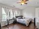 Bright bedroom with vaulted ceiling, hardwood floors, and multiple windows at 110 Great Ridge Ct, Morrisville, NC 27560