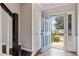 Inviting entryway showcasing the front door and staircase with natural light pouring in at 110 Great Ridge Ct, Morrisville, NC 27560
