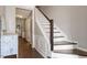 Foyer with staircase and a small table with traditional decor, perfect for welcoming guests at 110 Great Ridge Ct, Morrisville, NC 27560