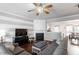 Spacious living room with a fireplace and hardwood floors, open to the dining area at 110 Great Ridge Ct, Morrisville, NC 27560