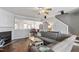 Inviting living room featuring a cozy fireplace, hardwood floors, and an open-concept layout at 110 Great Ridge Ct, Morrisville, NC 27560