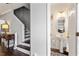 Charming powder room with a pedestal sink and modern patterned flooring, steps away from the staircase at 110 Great Ridge Ct, Morrisville, NC 27560