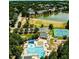 Aerial view of neighborhood amenities, including community pool, tennis courts, playground and lake at 1106 Brittley Way, Apex, NC 27502