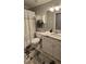Cozy bathroom featuring a shower with curtain and a decorative rug at 1106 Brittley Way, Apex, NC 27502