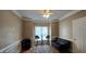 Bonus room with hardwood flooring, a wet bar, and a black futon at 1106 Brittley Way, Apex, NC 27502