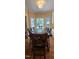 Bright dining area with windows overlooking the yard; perfect for Gathering meals at 1106 Brittley Way, Apex, NC 27502