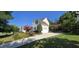 Charming home featuring a long driveway and meticulously landscaped front yard at 1106 Brittley Way, Apex, NC 27502