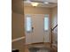 Welcoming home foyer with hardwood floors and natural lighting at 1106 Brittley Way, Apex, NC 27502