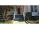 Inviting front porch with freshly painted stairs and decorative plants at 1106 Brittley Way, Apex, NC 27502