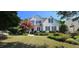 Charming two-story home with a manicured lawn and vibrant landscaping at 1106 Brittley Way, Apex, NC 27502
