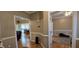 Spacious hallway displaying neutral decor, molding detail, and access to multiple rooms at 1106 Brittley Way, Apex, NC 27502