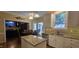 Well-equipped kitchen with granite counters, island, stainless appliances, and eat-in area at 1106 Brittley Way, Apex, NC 27502