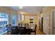 Open kitchen and eat-in area featuring stainless appliances, tile backsplash, and white cabinets at 1106 Brittley Way, Apex, NC 27502