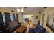 Comfortable living room featuring hardwood floors, leading to the kitchen with a dining area at 1106 Brittley Way, Apex, NC 27502