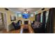 Cozy living room with hardwood floors, fireplace, large windows, and comfortable seating at 1106 Brittley Way, Apex, NC 27502