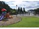 Community playground with colorful slide and splash pad offers Gathering-friendly recreation at 1106 Brittley Way, Apex, NC 27502