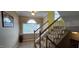 Staircase with carpeted steps and a semi-circle window with natural light at 1106 Brittley Way, Apex, NC 27502