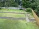 View of the backyard showing tiered landscaping, wooden fence, and plenty of room to enjoy outdoor living at 1126 Woodlands Creek Way, Apex, NC 27502