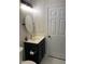 Bathroom with a vanity, mirror, and a white door at 1126 Woodlands Creek Way, Apex, NC 27502