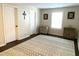 Bedroom with patterned rug, dark wood floors and several pieces of wall decor at 1126 Woodlands Creek Way, Apex, NC 27502