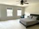 Bright bedroom with neutral tones, large windows and comfortable bedroom at 1126 Woodlands Creek Way, Apex, NC 27502