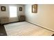 A spacious room with a patterned rug, dark wood floors and several pieces of furniture at 1126 Woodlands Creek Way, Apex, NC 27502