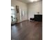Bright entryway with wood floors, stylish cabinet, and decorative front door at 1126 Woodlands Creek Way, Apex, NC 27502