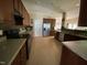 Modern kitchen with stainless steel appliances, ample counter space, and convenient access to dining and living areas at 1126 Woodlands Creek Way, Apex, NC 27502